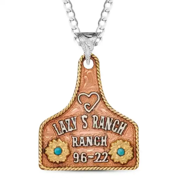 The Meagan Cow Tag Neckace is crafted on a hand engraved, Copper base. Detailed with a Jeweler's Bronze rope edge, flowers and German Silver lettering. Scroll down to customize the lettering & stones. 1.75""x1.5""

Pair with a St